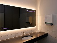 WireTap Indoor Lighting 04  Mirror in a washing room, illuminated with WireTap cable and colour change LED lights.